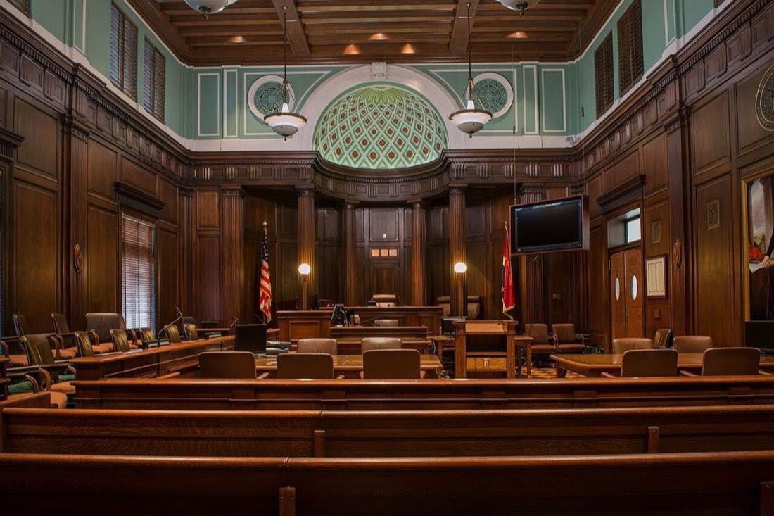 Interior of a United States federal courthouse courtroom, where AI voice clone cases like Lehrman v. Lovo are decided