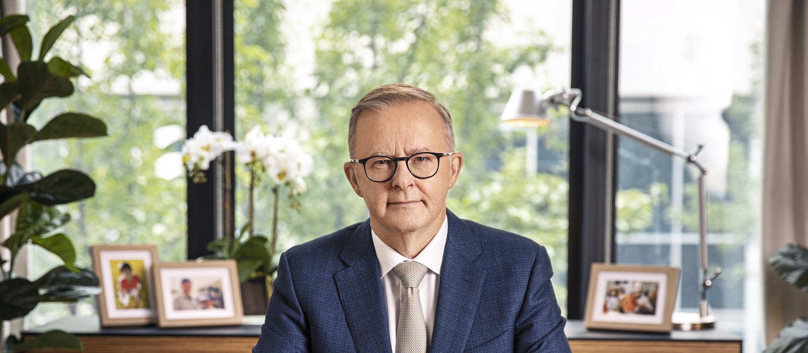 Australian Prime Minister Anthony Albanese seated at his office desk, who said AI training without artist control is theft