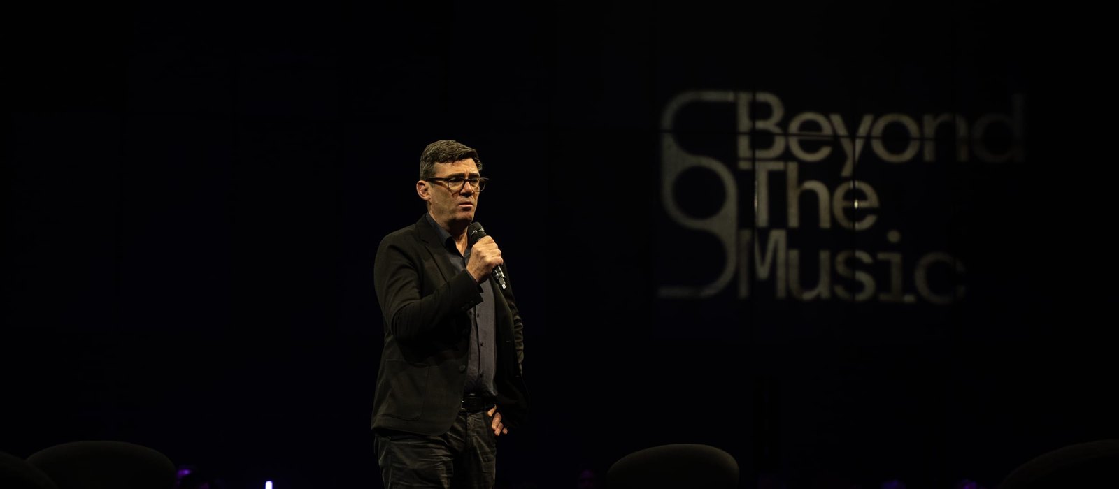 Andy Burnham speaking on stage at Beyond The Music 2024, the festival hosting his Creative Industries AI Summit