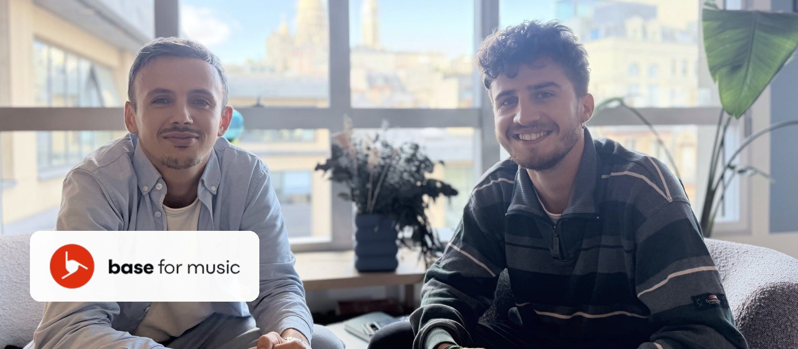 Base for Music founders Maxence Bazin and Victor Guerand sitting in their office, with the Base for Music logo