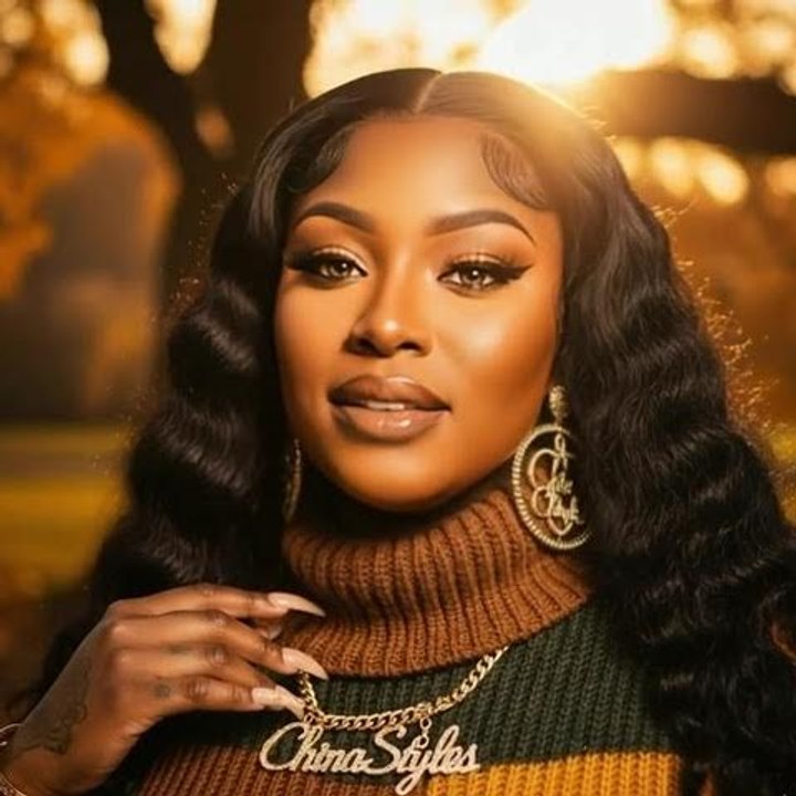 China Styles persona portrait wearing a gold ChinaStyles nameplate necklace against an autumn backdrop