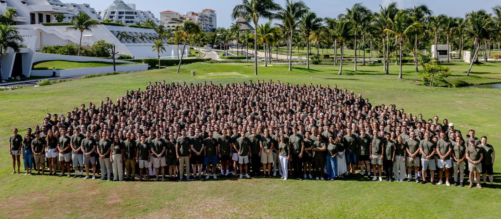 Hundreds of ElevenLabs employees posing for a group photo on a lawn, from the company's $22 billion tender announcement