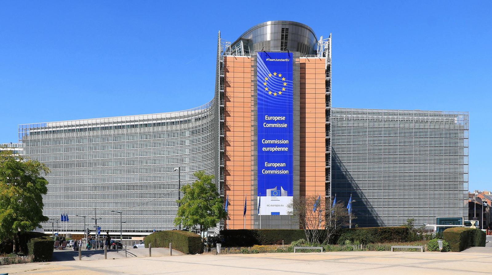 The Berlaymont building in Brussels with a large European Commission banner, headquarters of the EU executive enforcing the AI Act