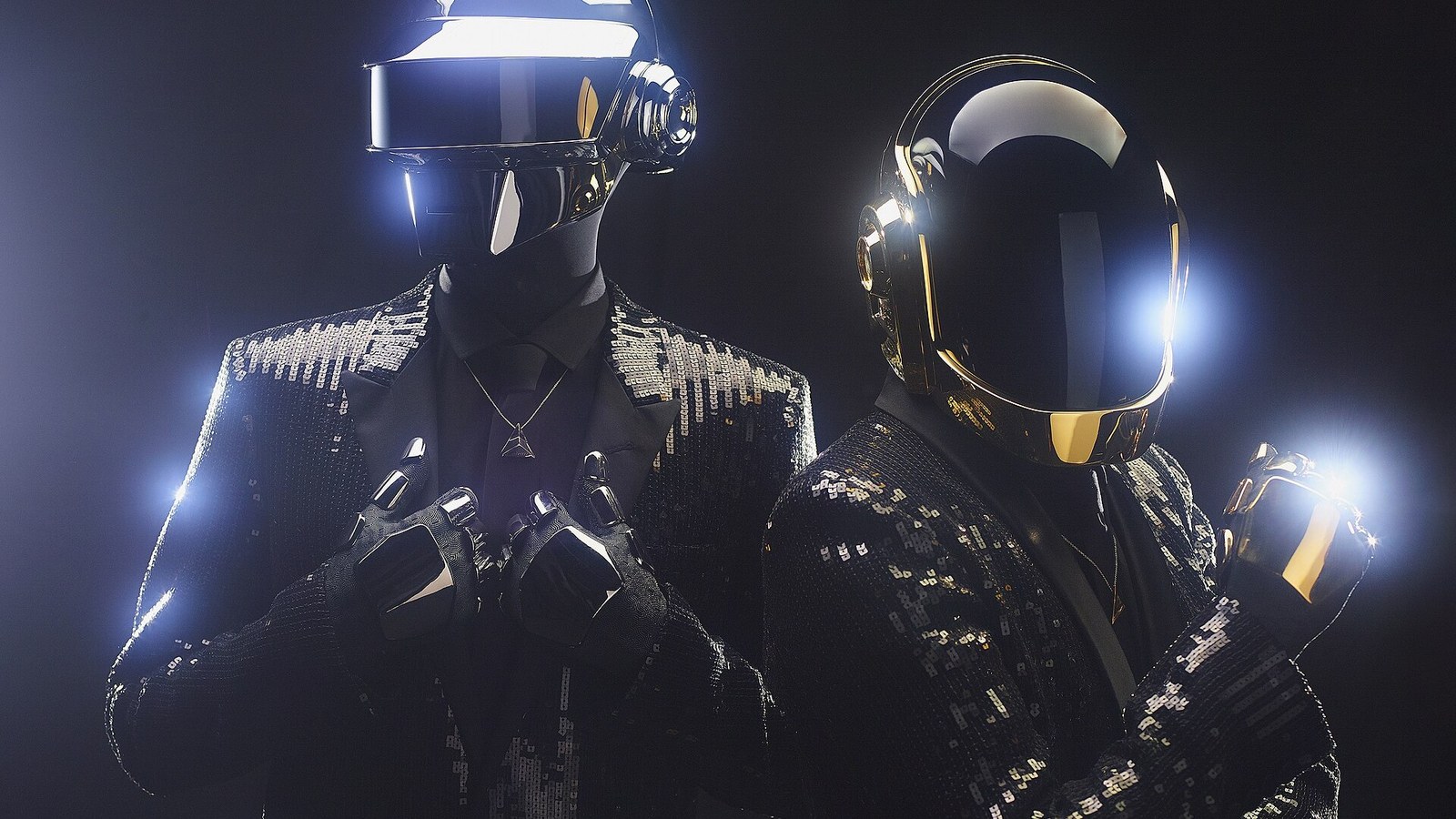 Daft Punk in their gold and silver robot helmets, photographed for the Random Access Memories press campaign