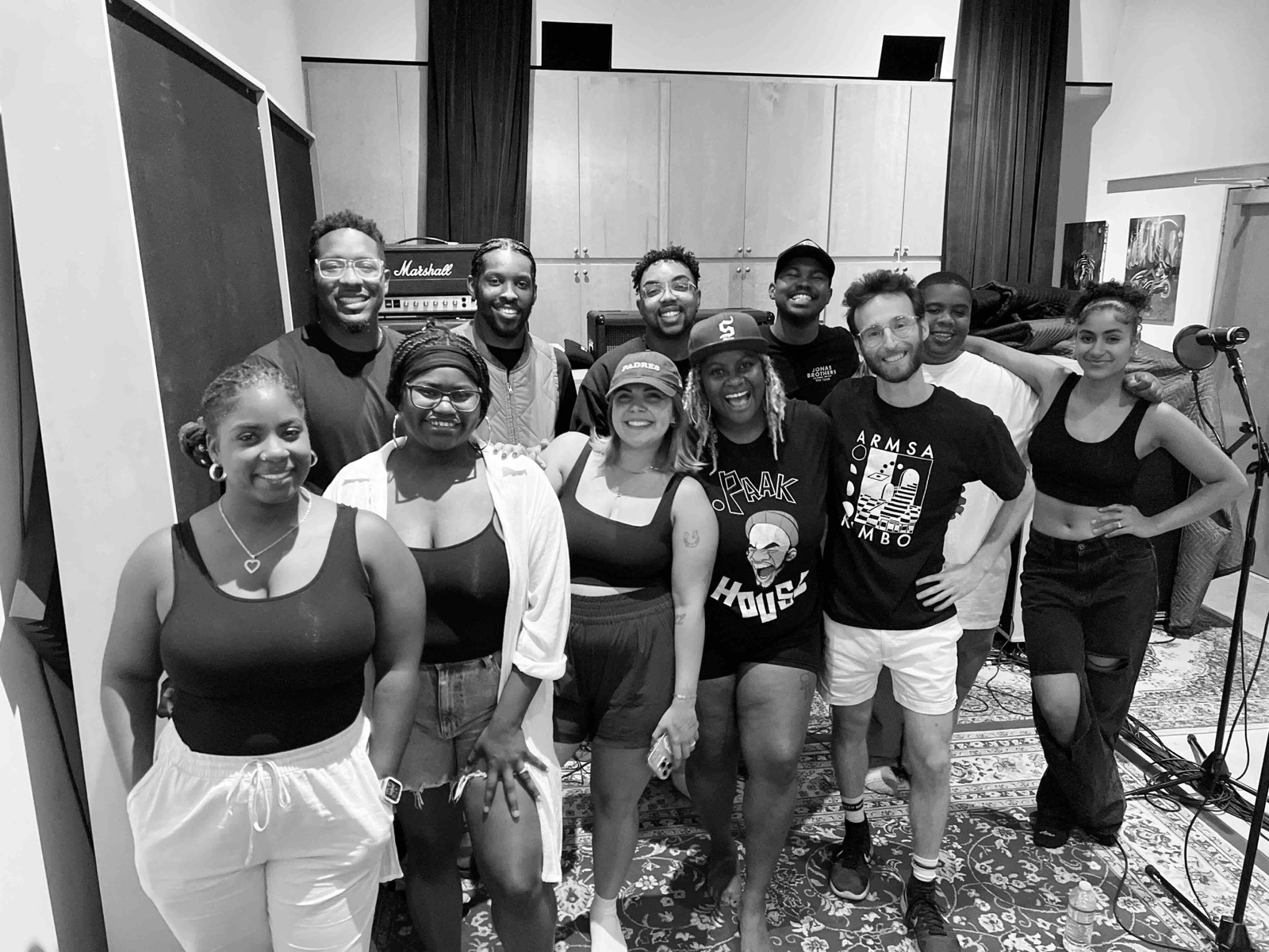 Gospel singers gathered around microphones during the recording sessions for the I AM CHOIR gospel model.