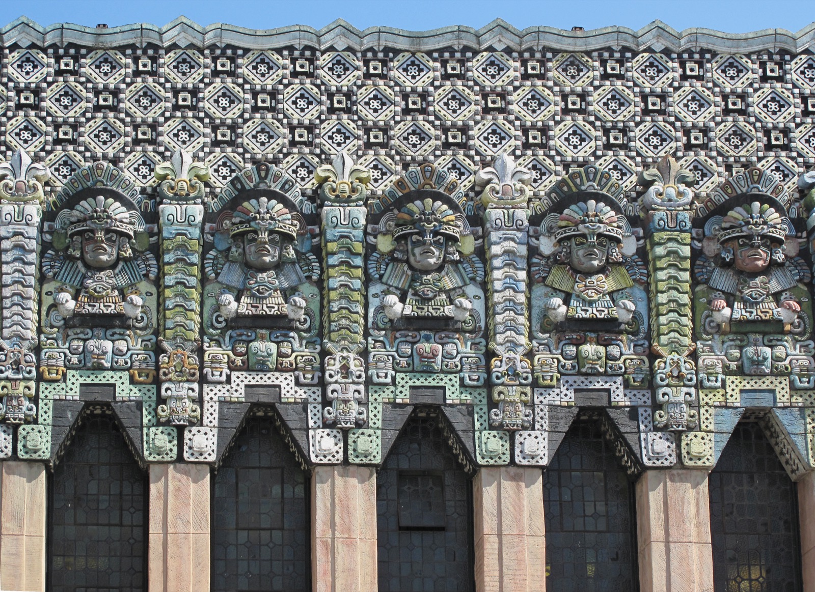 The facade of the Mayan Theater in Downtown Los Angeles, covered in pre-Columbian style relief figures and geometric tilework.