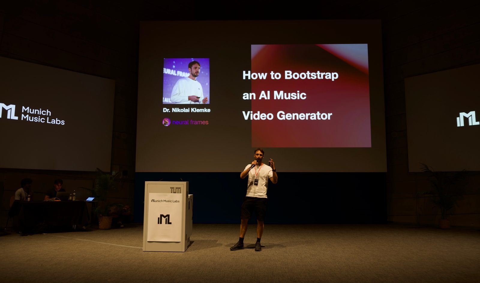 Neural Frames founder Nicolai Klemke on stage at Hackatune 2026 at the Technical University of Munich