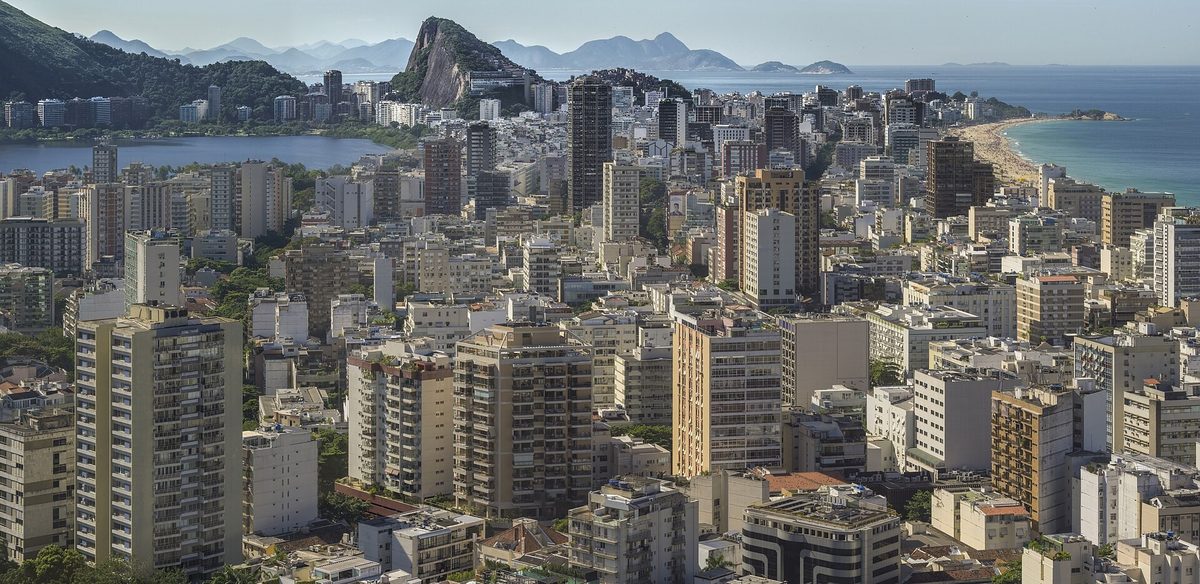 The Ipanema and Leblon neighbourhoods of Rio de Janeiro seen from Morro Dois Irmaos, dense apartment blocks between the lagoon and the sea.