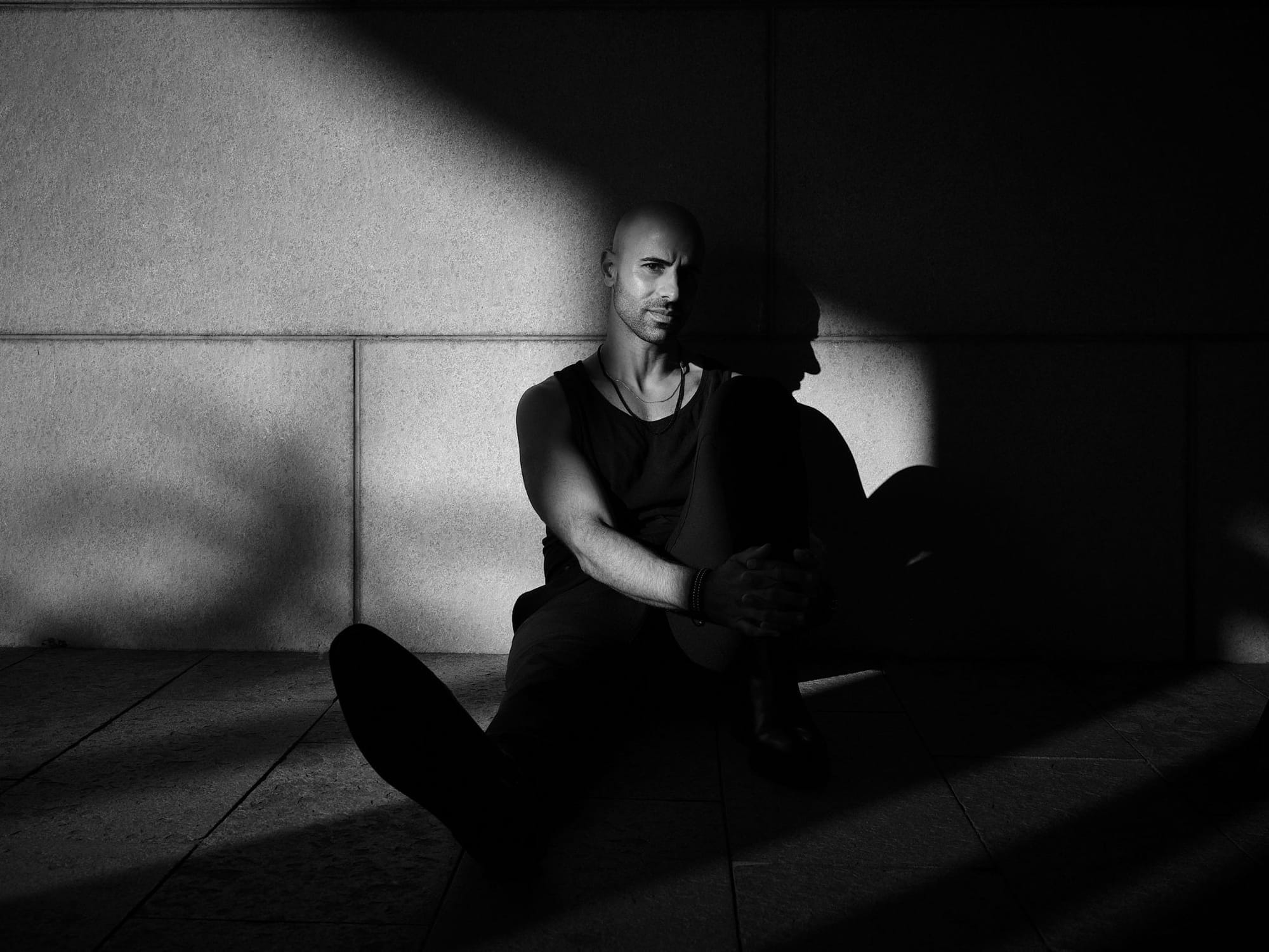 Los Angeles live electronic artist RIŽIK, known offstage as Hisham Dahud, in a press portrait