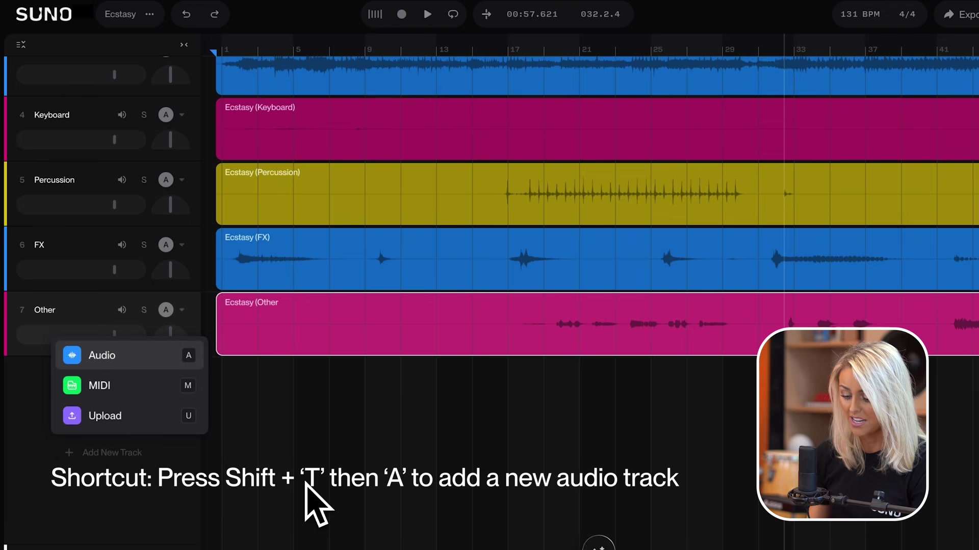 Suno Studio track list with color-coded tracks and the Shift+T then A shortcut hint for adding a new audio track