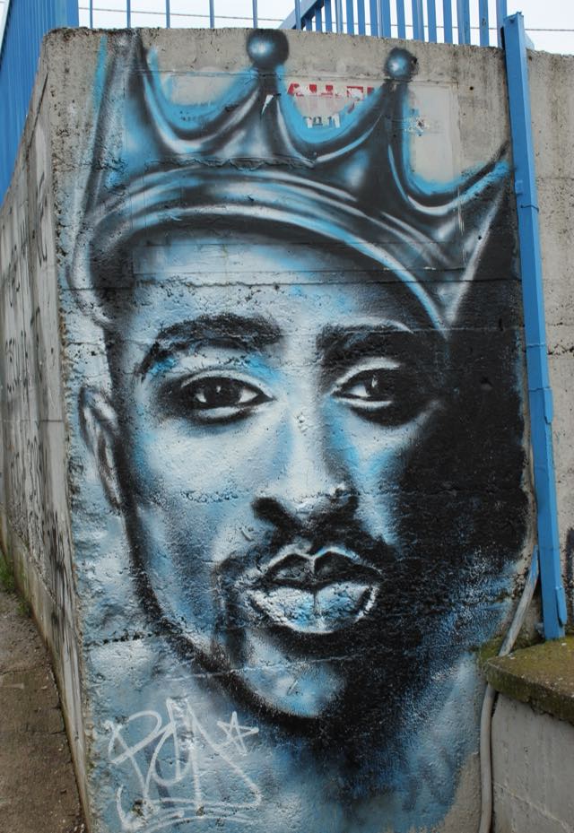 A street mural tribute to Tupac Shakur, whose likeness Sega recreated for Stranger Than Heaven