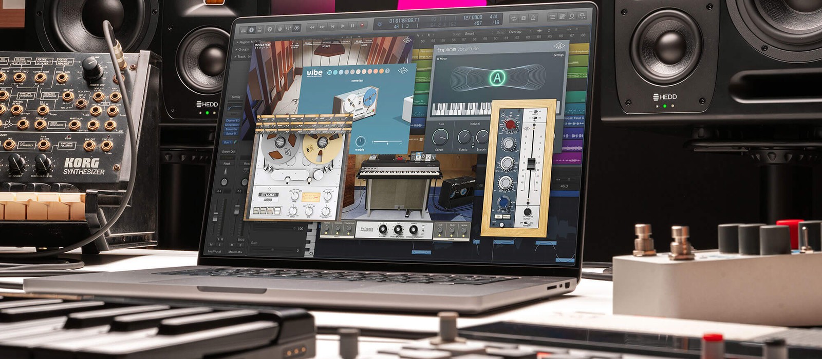 Universal Audio LUNA 3.0 session open on a laptop in a studio, showing Topline Vocal Tune and UAD plugin windows