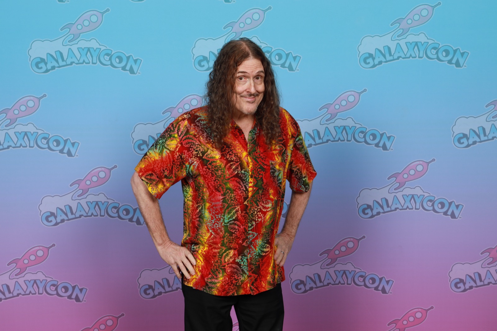 Weird Al Yankovic in a colorful patterned shirt at a GalaxyCon 2025 photo op