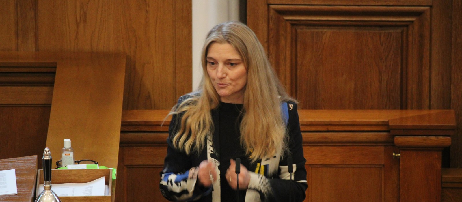Zenia Stampe, now Denmark's culture minister, speaking from the lectern in the Folketing chamber at Christiansborg