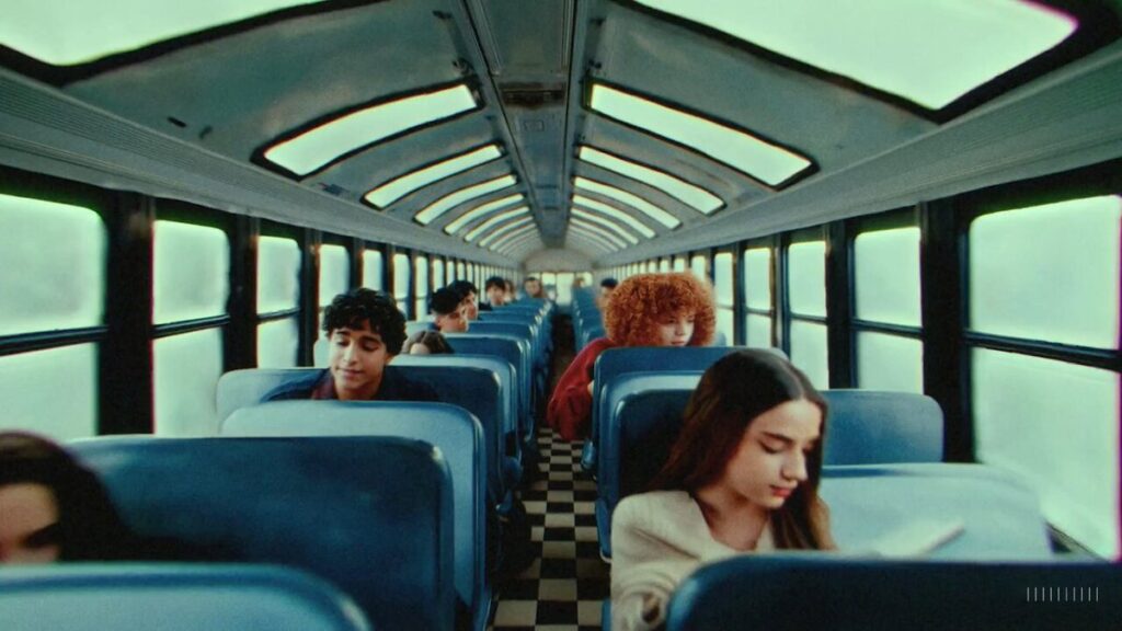 Bus scene in the AI music  video for "The Hardest Part" by the band Washed Out.