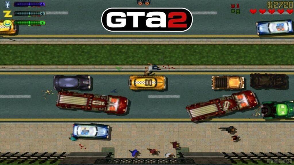 A top-down view of a pixelated city street from the classic 1997 video game Grand Theft Auto (GTA) 1. The scene depicts a bird's-eye perspective of a busy urban environment with various vehicles, including cars, trucks, and buses, navigating the roads. The graphics are rendered in a retro, low-resolution style with a color palette reminiscent of early PC gaming. Recognizable elements such as buildings, traffic lights, and pedestrians can be seen, capturing the essence of the game's open-world gameplay and criminal underworld theme.