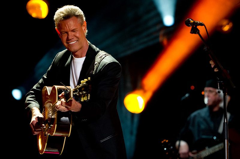 Randy Travis performing at the CMA Festival 2013, shortly before he suffered a massive stroke. Now, thanks to AI, he has his voice back.