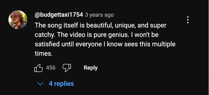 Comment praises "Alpha-Zulu" as beautiful and catchy, urging others to watch the video.